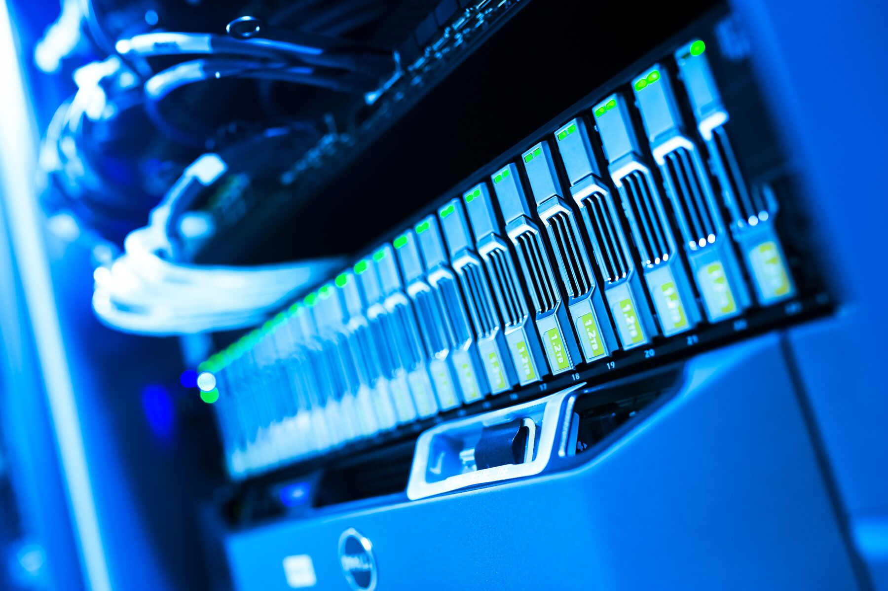 Networking and server hardware lit in a server room